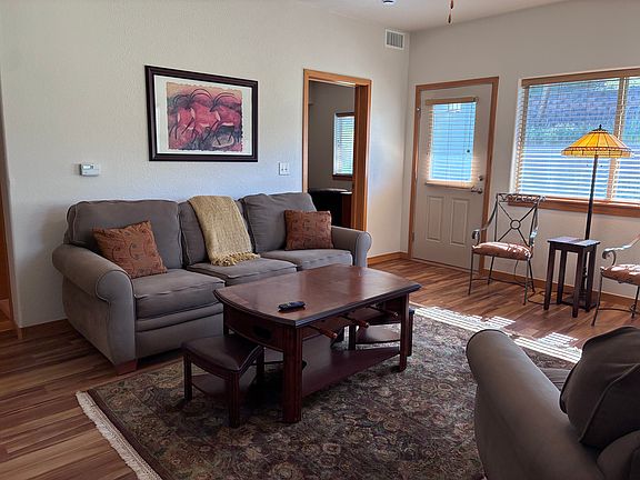 Living room with view into master bedroom