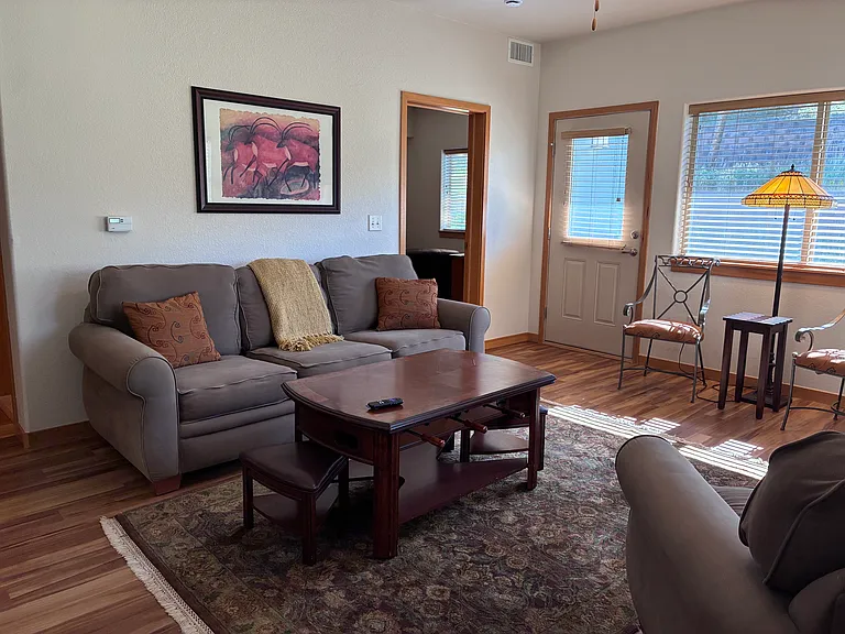 Living room with view into master bedroom