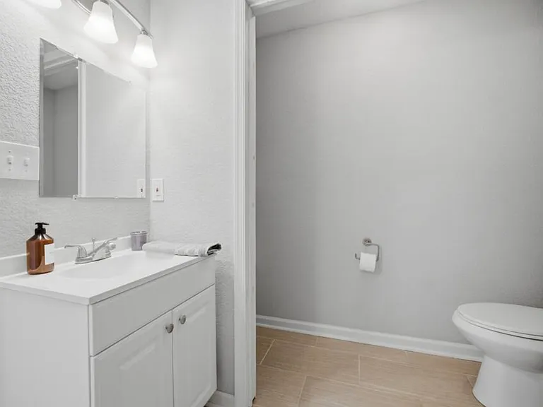 Primary en-suite bathroom with 2 vanity sinks.