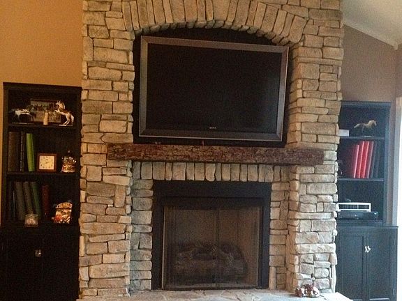 stone fireplace and cabinets