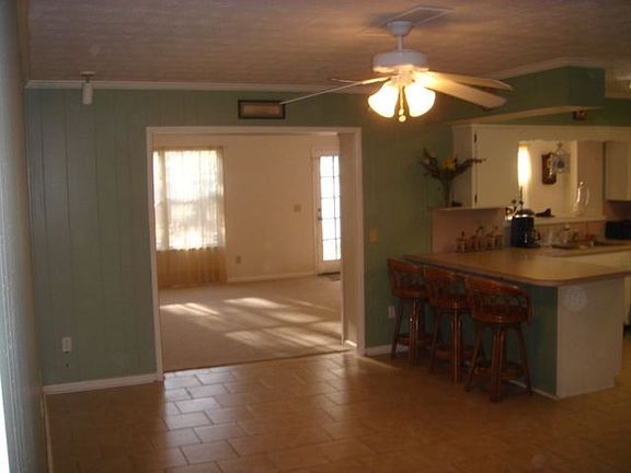 Country kitchen breakfast area leading back into Family Room