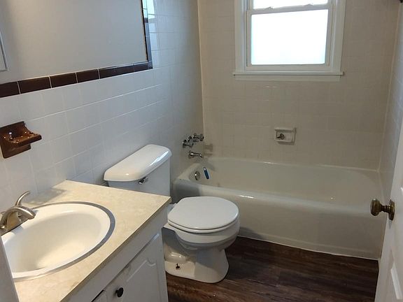 Bathroom with new flooring (picture may not be of exact unit, but very similar)