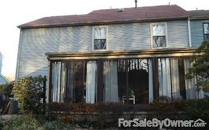 Rear of home
						:
						Rear of home with patio room across back of house