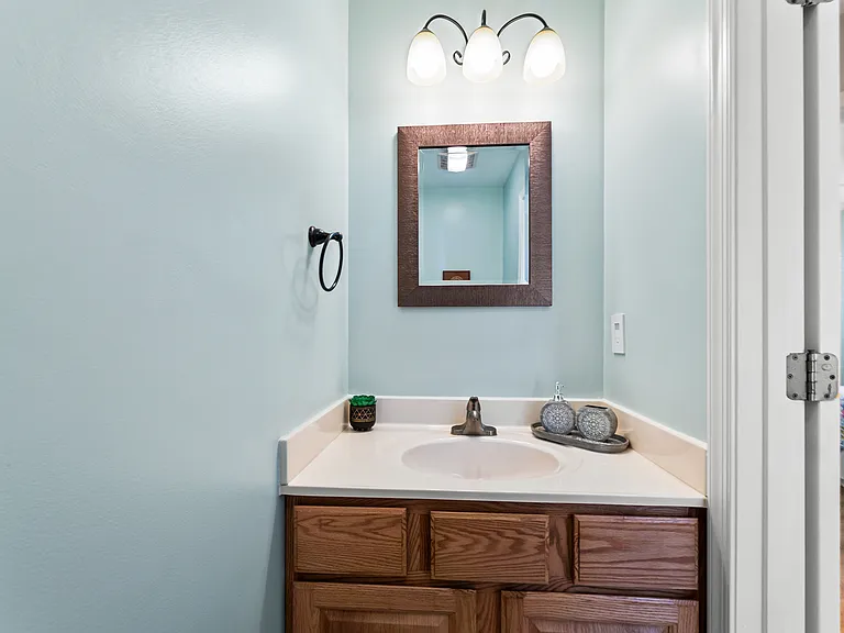 Convenient first-floor half bathroom located near the main living areas.