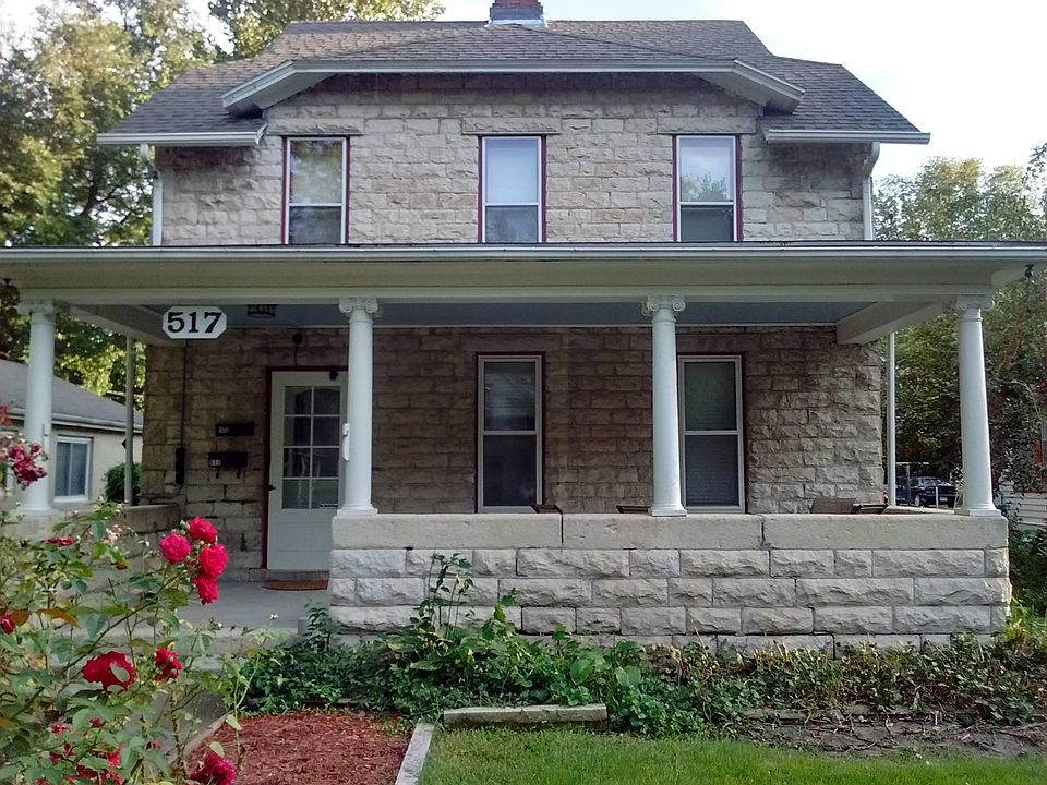 Exterior of house with porch for use.