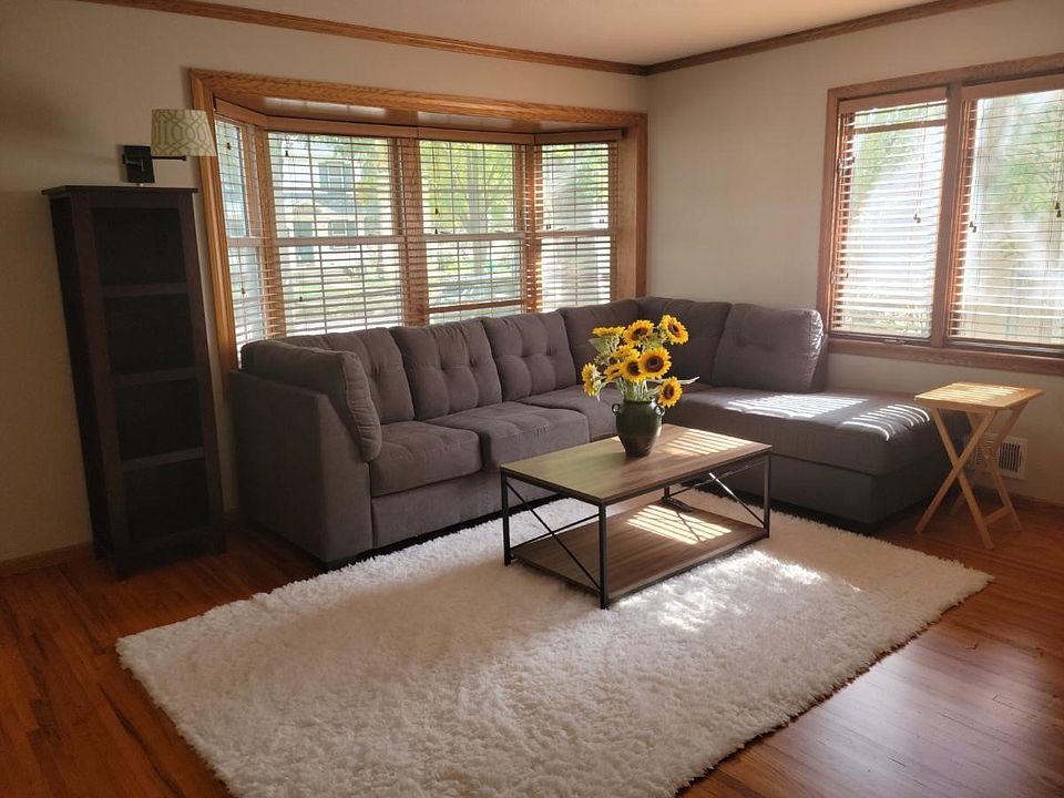 Living room with hardwood floors and bay window