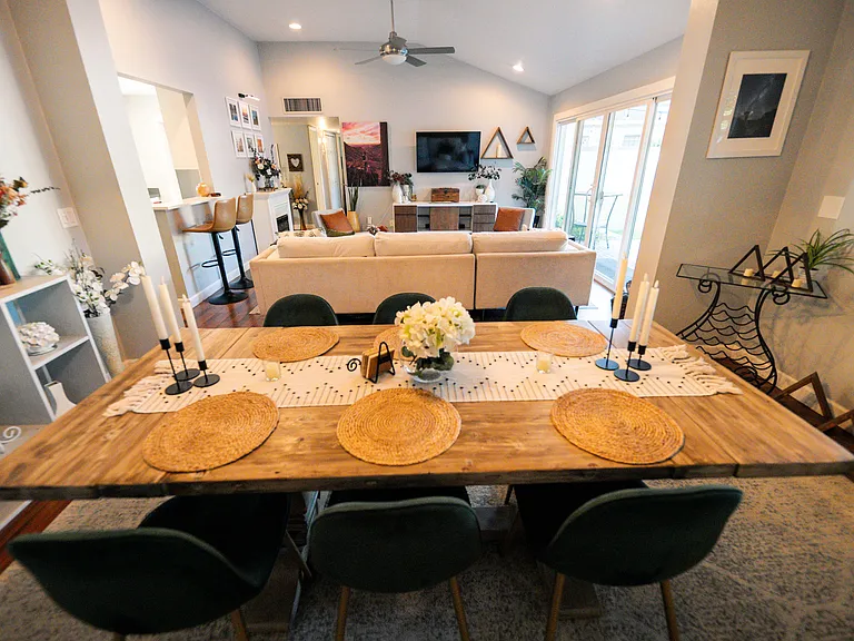 Restoration Hardware dining table with easy view of the TV, if that is your style