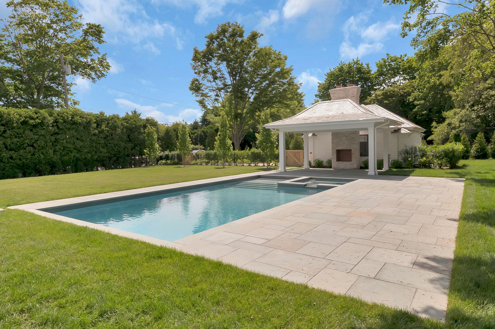 Privacy assured by 22' mature Arborvitae hedge