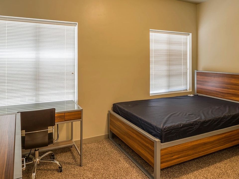 Bedroom with desk and dresser included