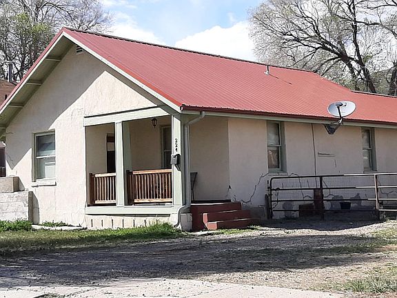 Newer red metal roof with down spouts.