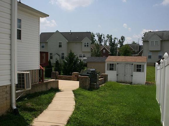 Side with patio and shed