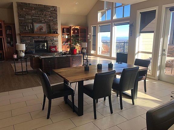 open floor plan with gas fireplace and media console with bluetooth music stereo.