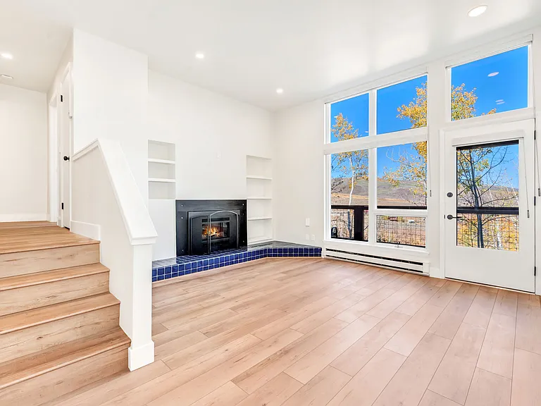 Living room with gas fireplace and walk out to back deck.
