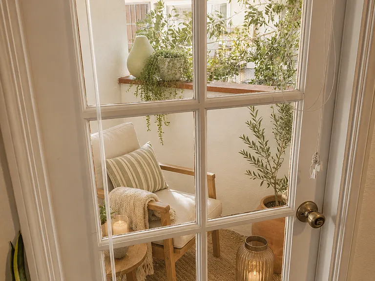 2nd story bedroom balcony - Virtually staged to showcase the home's layout with furnishings and highlight the potential look and feel of the furnished option.