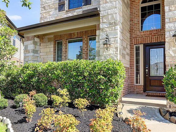 This house has curb appeal and well maintained landscaping.