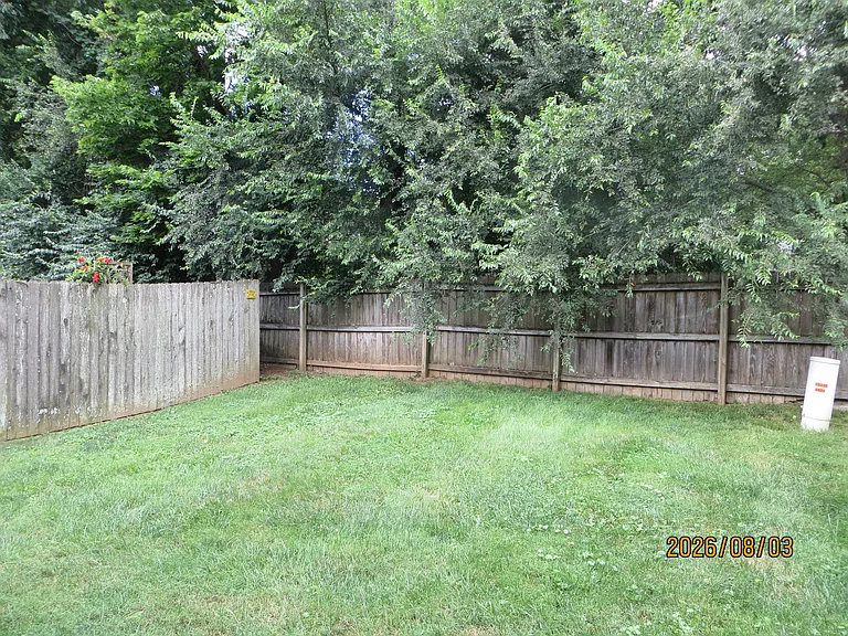 Backyard is very nice but it is NOT enclosed with a privacy fence and gate. The side fence is another unit's fence, the back fence is the property line fence.
