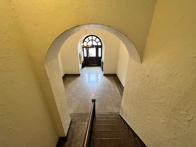 The lobby is very welcoming and well-lit. There is a secondary side entrance, not pictured, that conveniently lets out to the residential side street - where you will find ample parking.
