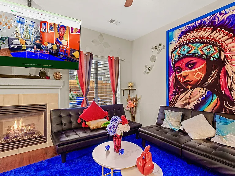 Cozy living room with a fireplace, perfect for relaxing after a day of exploring.