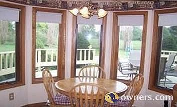 Kitchen nook overlooking field and deck