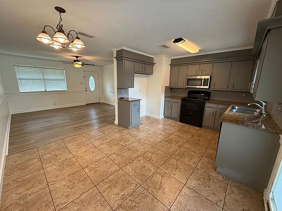 View from kitchen and eating area to living area.