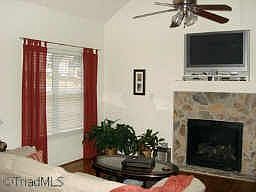 Open Living Room w/ Stone Faced fireplace