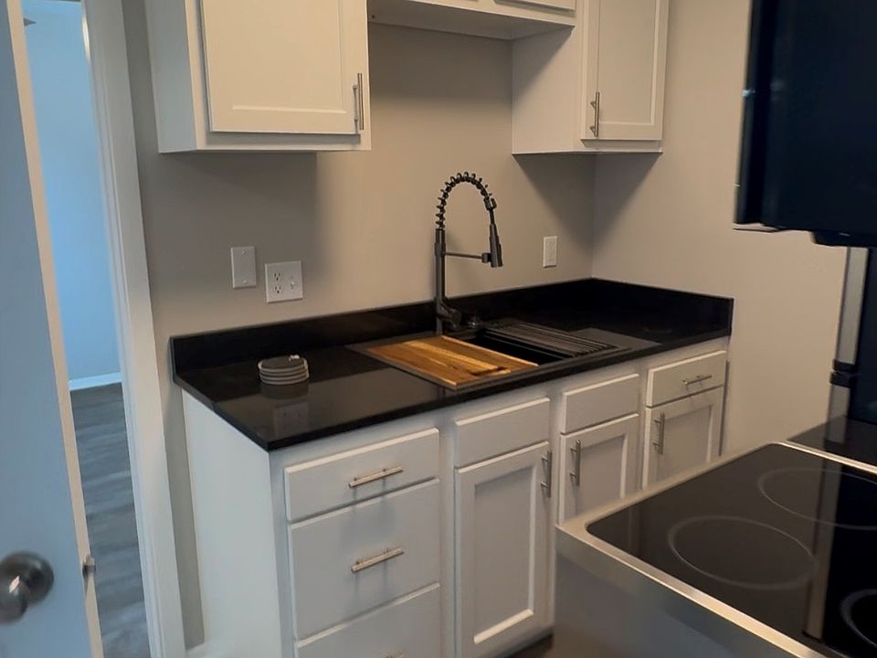 New White Cabinets, Black Granite Counters & Stainless Hardware