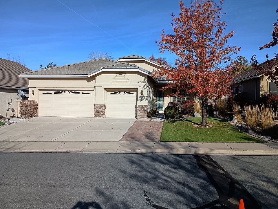 Front of house, with front patio, astroturf and professionally xeroscaped yard.