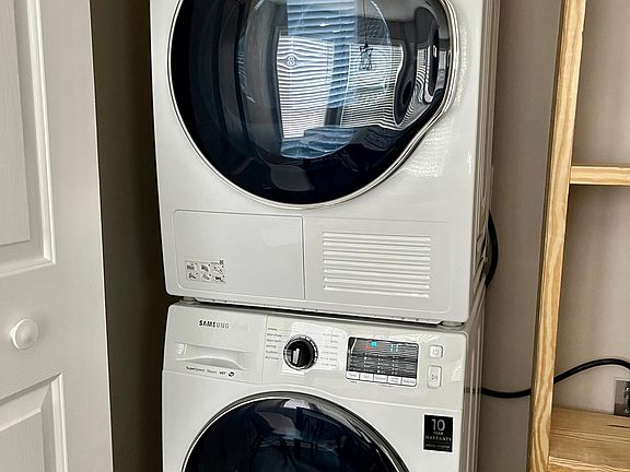 Washer and dryer are downstairs in the kitchen area.