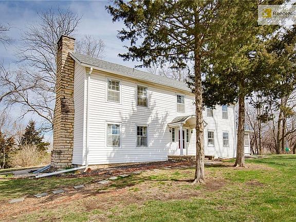 Newer roof and vinyl siding protect the beauty of this home