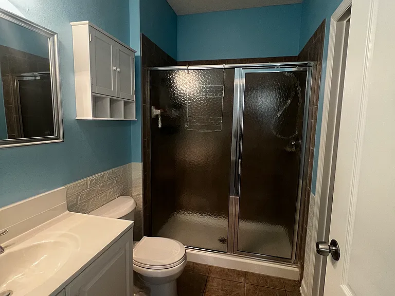 Master bath. Walk in closet to right inside bathroom.