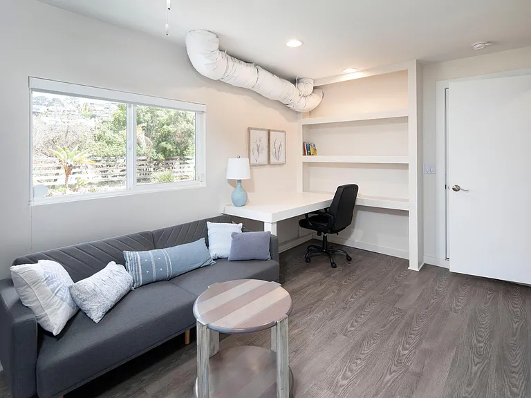 Built in desk and own entrance to the garage or staircase upstairs