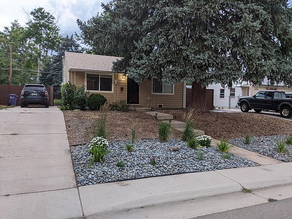 Xeriscaped front yard with auto timed drip line.