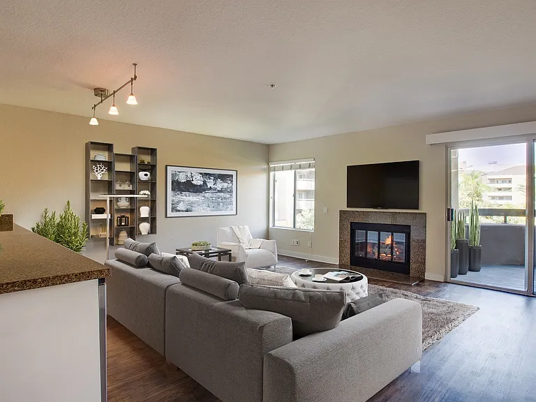 Living room comes with a fireplace and vaulted ceiling