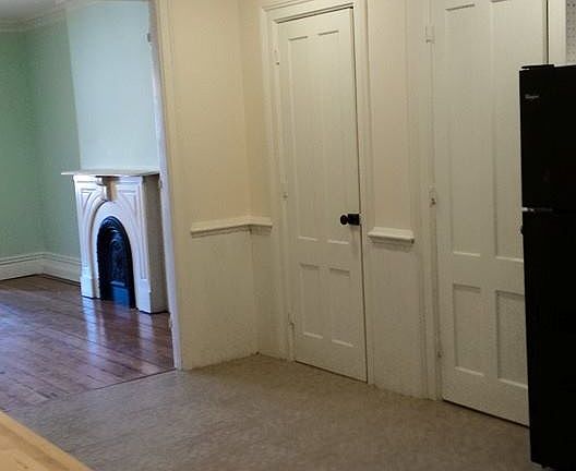 first part of eat in kitchen with double pantry doors visible