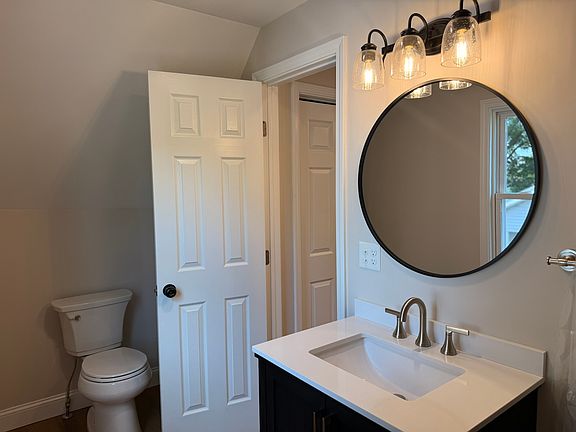 BATHROOM - huge tiled shower, all brand new fixtures and finishes, new beautiful solid wood vanity with quartz top.