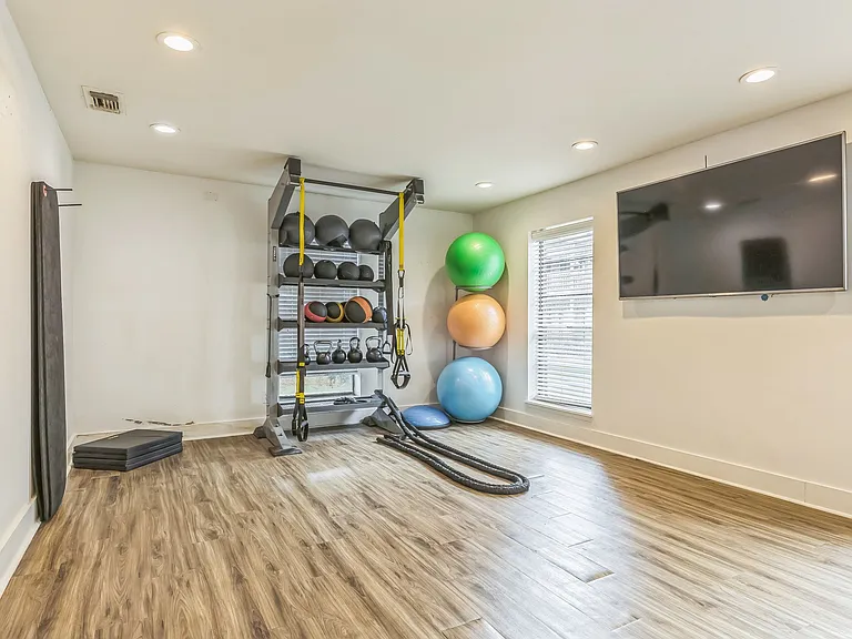 Enjoy varied workouts with medicine balls and entertainment on wall-mounted TVs in our well-equipped fitness room, professionally operated by Highlands Vista Group.