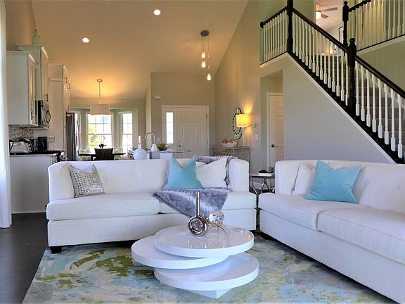 living area w/ vaulted clgs