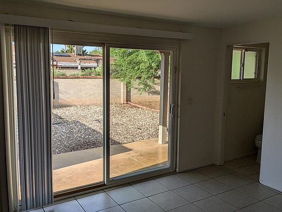 View of Primary Suite and its sliding door to the yard