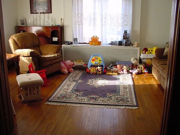 Living Room w/ hardwood floors & oak pocket doors