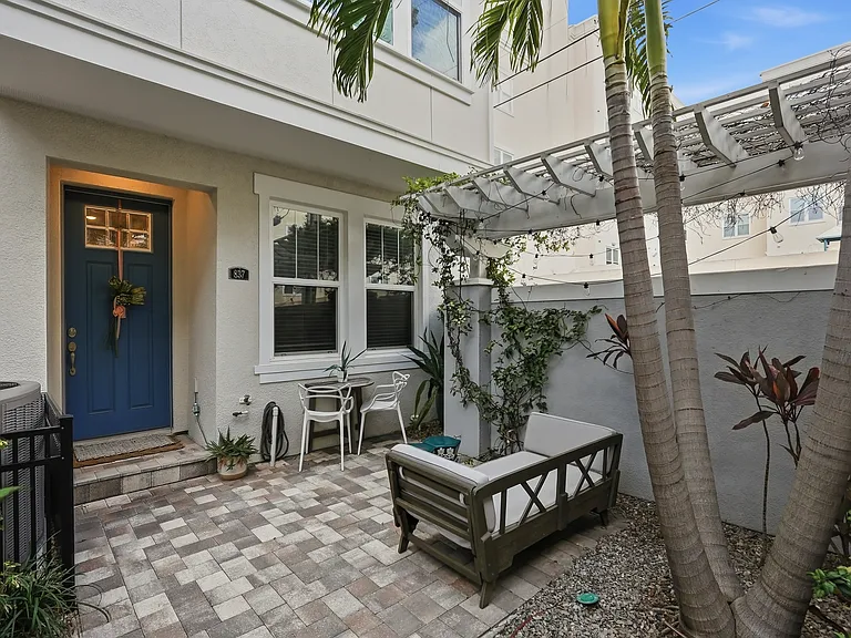 Private courtyard on the end with pergola and room to relax, garden, or entertain
