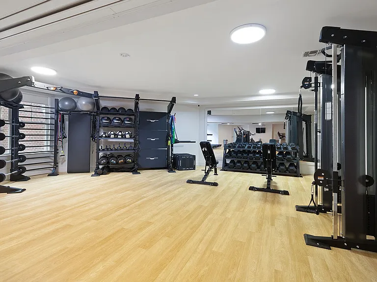 Strength zone with free weights, racks, and versatile training gear