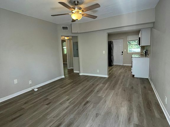 looking into the living room and kitchen from the front door