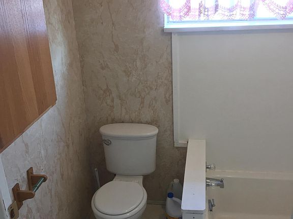 Bathtub as pictured in addition to a shower in the basement