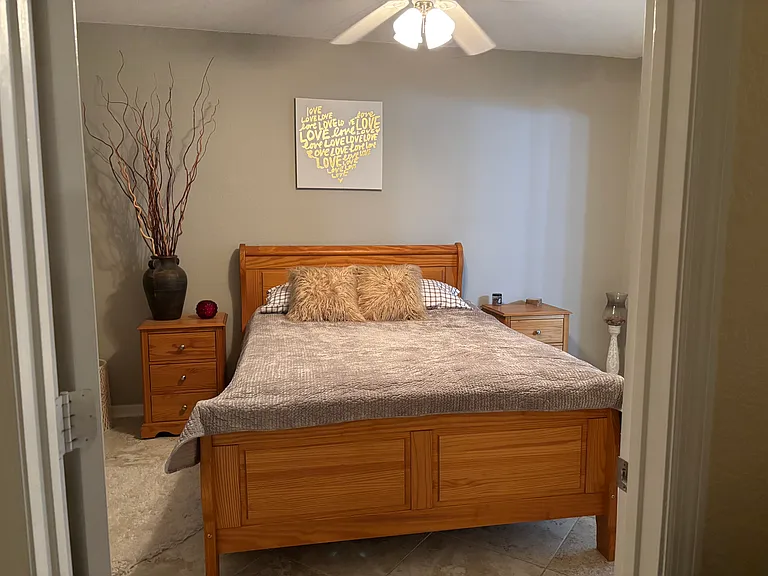 Lay in a queen size bed and listen to the fountain trickling in the pond in your backyard!