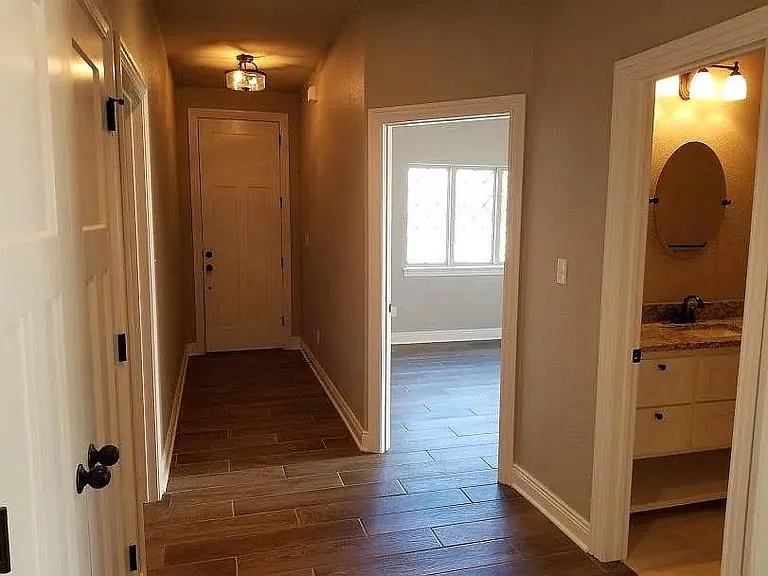 front entry with 2nd bedroom on right and hall bath on right
