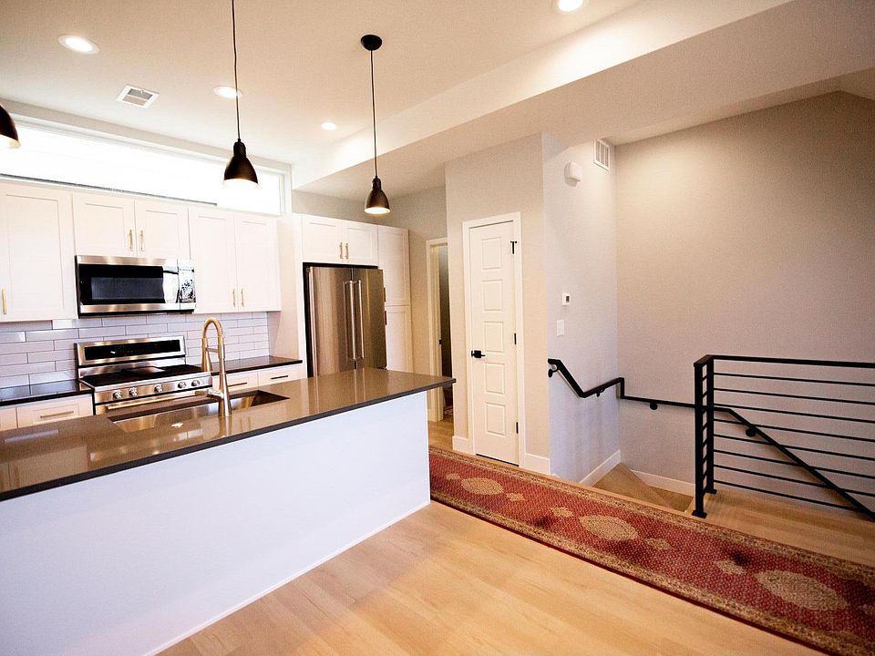 High end kitchen appliances with subway tile backsplash