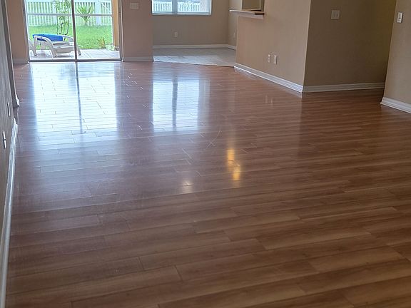 Open plan view from front entrance as you walk into the house, lots of natural sunlight.