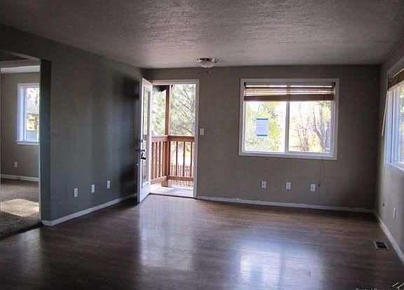 living room looking towards front door - small hallway to bedrooms 1 and 2 on the left