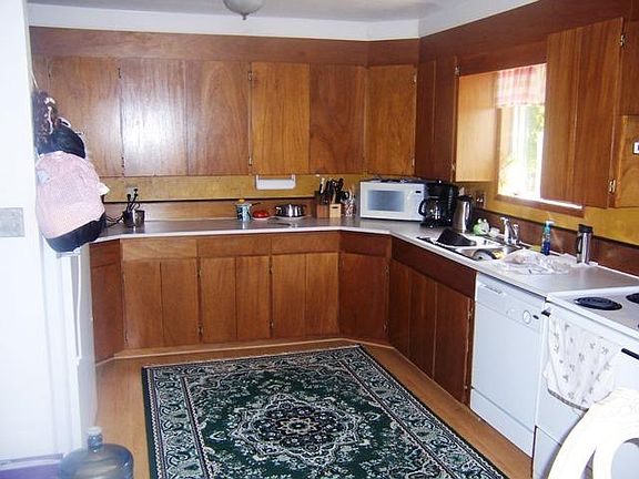 Large kitchen with lots of cupboard space and counters. All the appliances will stay and each unit a