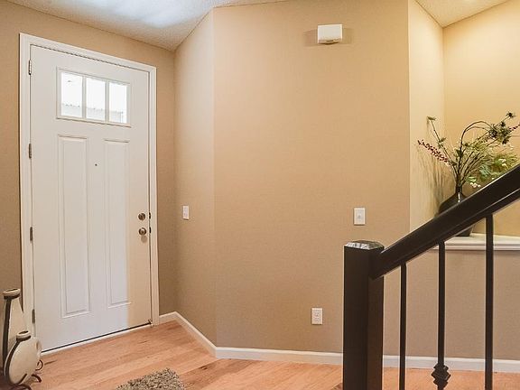 Right when you enter you notice the gorgeous wood floors, tall ceilings and dramatic stairs!